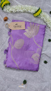 Purple scarf with floral patterns on a light gray background, featuring a Thani brand tag.