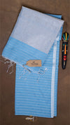 Blue and gray striped towel with a brand label on a brown surface