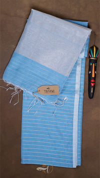 Blue and gray striped towel with a brand label on a brown surface