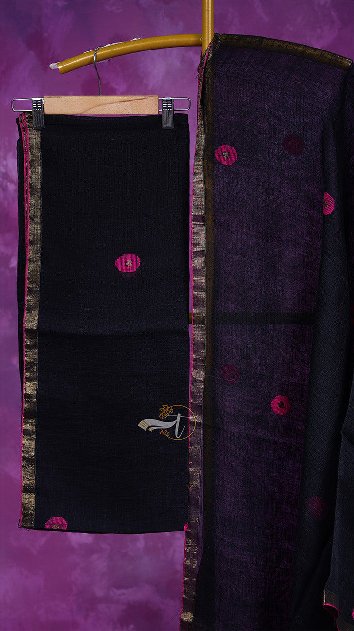 Black fabric with pink buttons on a hanger against a purple background