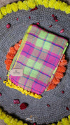 Colorful plaid fabric on a decorative mat with flowers