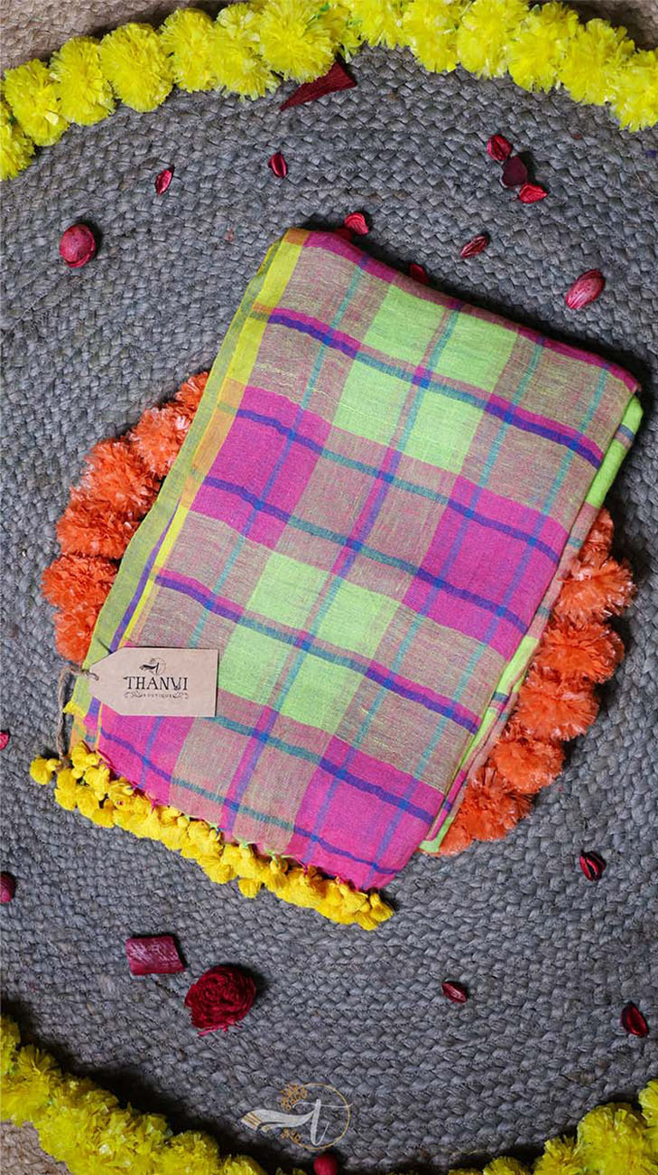 Colorful plaid fabric on a decorative mat with flowers
