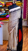 Saree with geometric pattern on a mannequin in a store setting