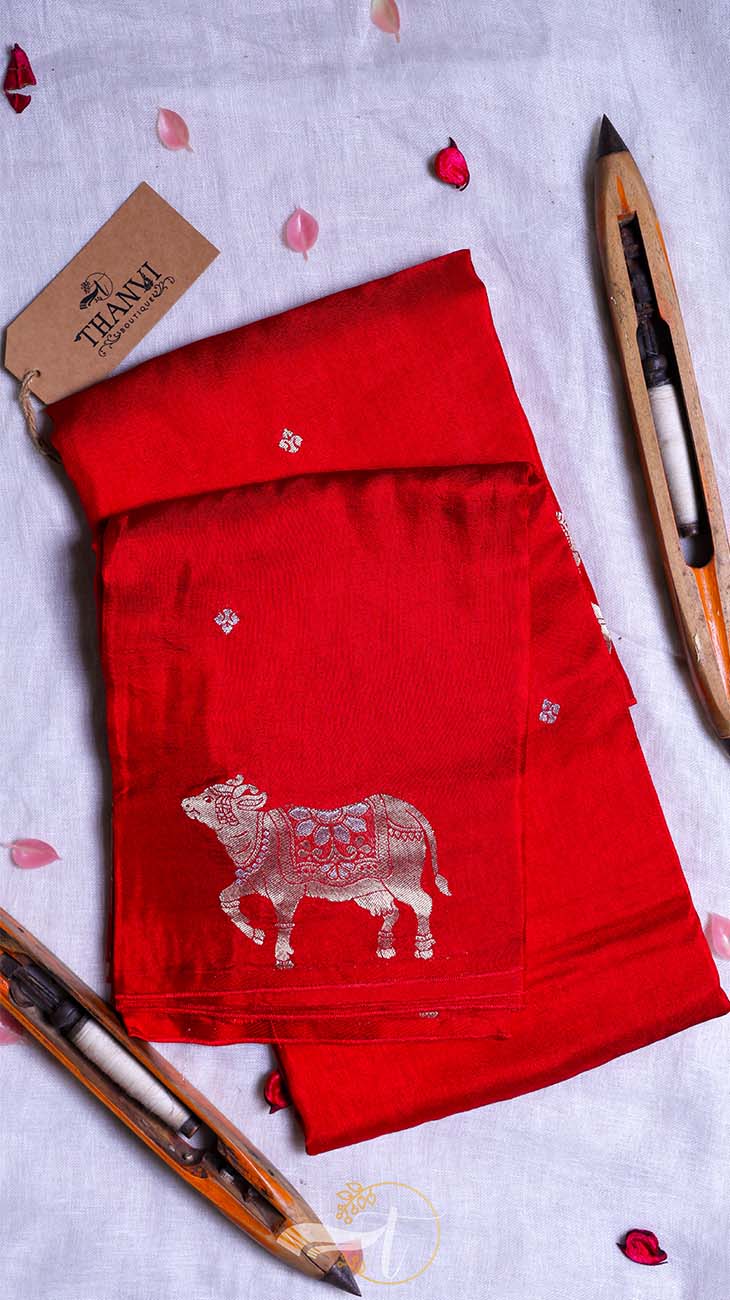 Red fabric with a bull design on a light gray background