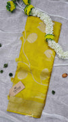 Yellow fabric with white patterns on a gray background