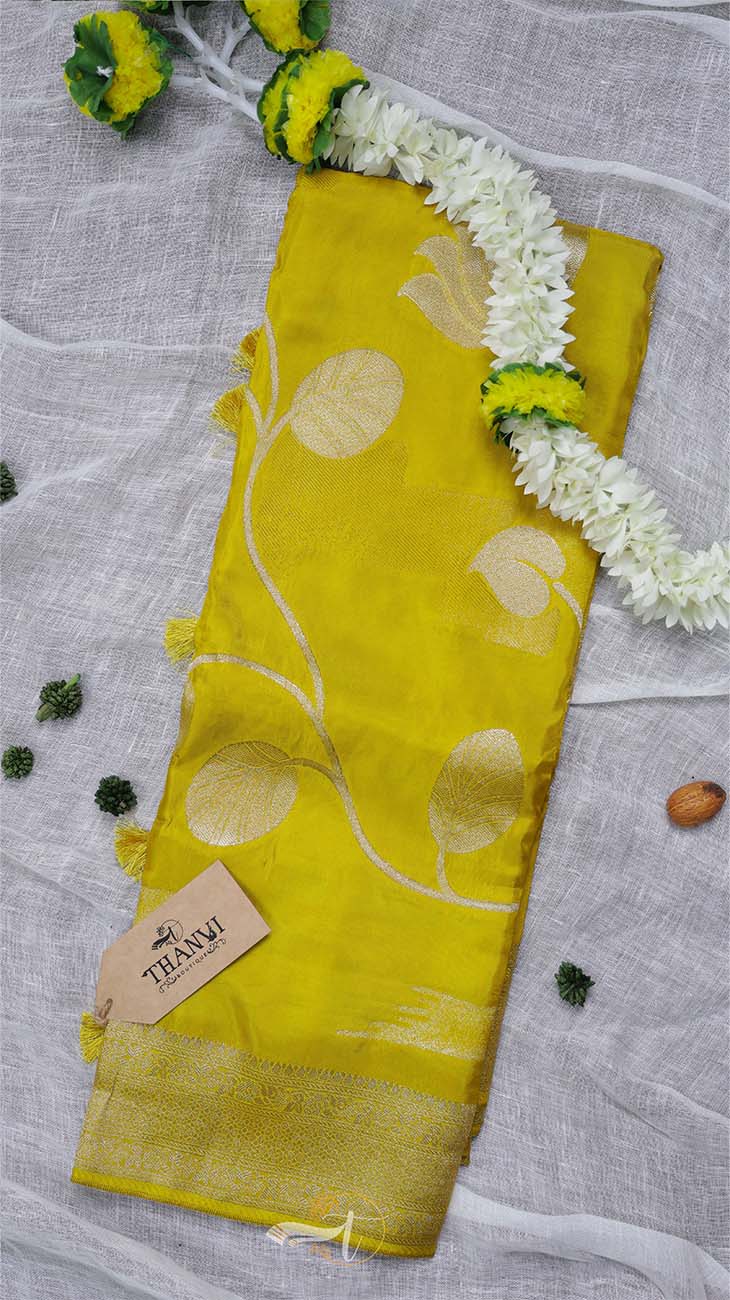 Yellow fabric with white patterns on a gray background