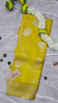 Yellow fabric with white patterns on a gray background