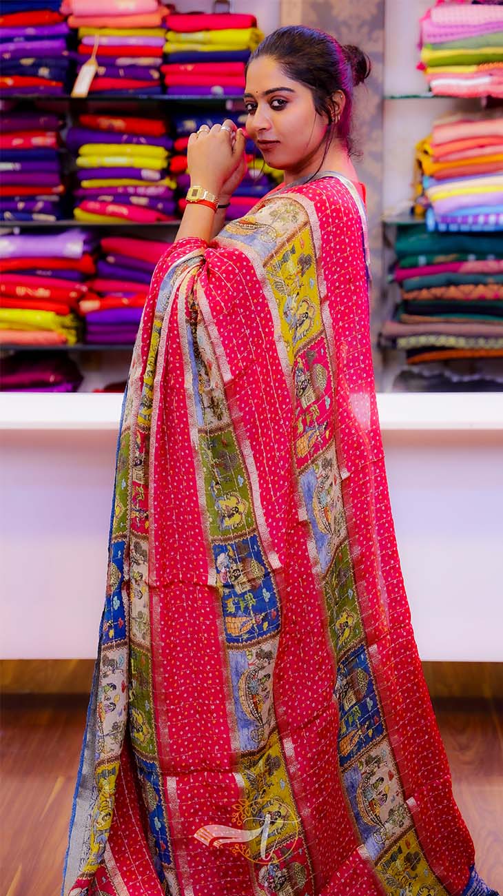 Woman wearing a colorful saree in a fabric store
