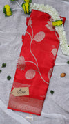 Red fabric with floral patterns on a gray background