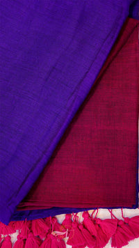 Close-up of purple and red fabric with tassels