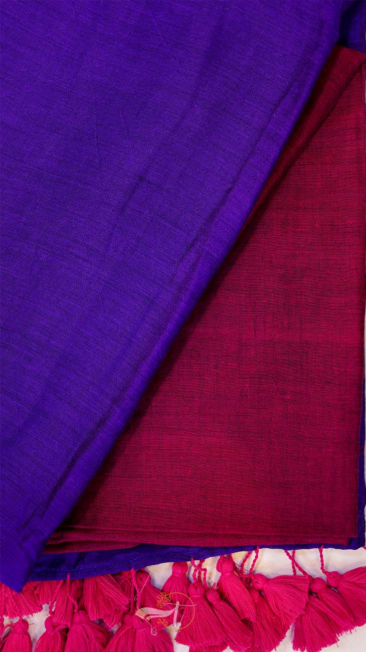 Close-up of purple and red fabric with tassels