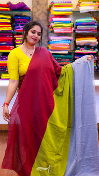 Woman holding colorful fabrics in a fabric store
