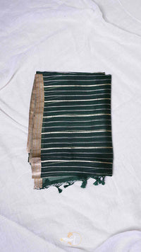 Green and brown striped fabric with tassels on a white background