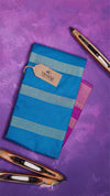 Blue fabric with a tag on a purple background