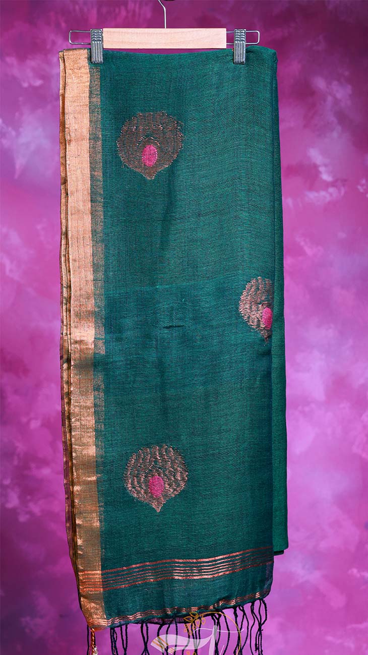 Green scarf with pink and gold patterns on a purple background