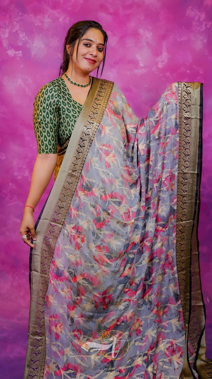 Woman wearing a floral saree with a pink background