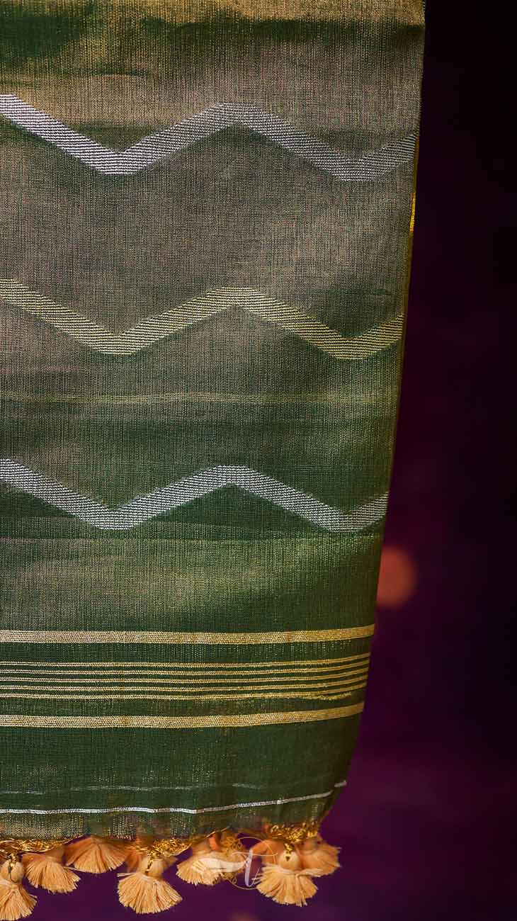 Green fabric with white zigzag pattern on a purple background