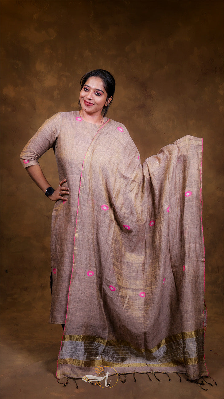 Woman wearing a traditional outfit with a brown background