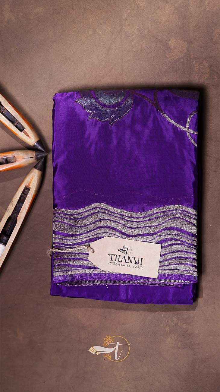 Purple fabric with a brand label on a brown background