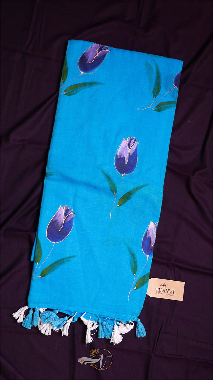 Blue scarf with purple tulip patterns on a dark background