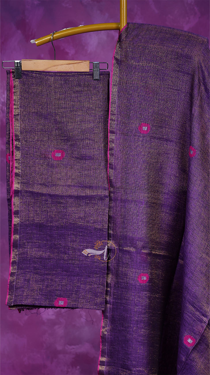 Purple fabric with pink circular patterns on a purple background