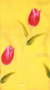 Two red tulips on a yellow background