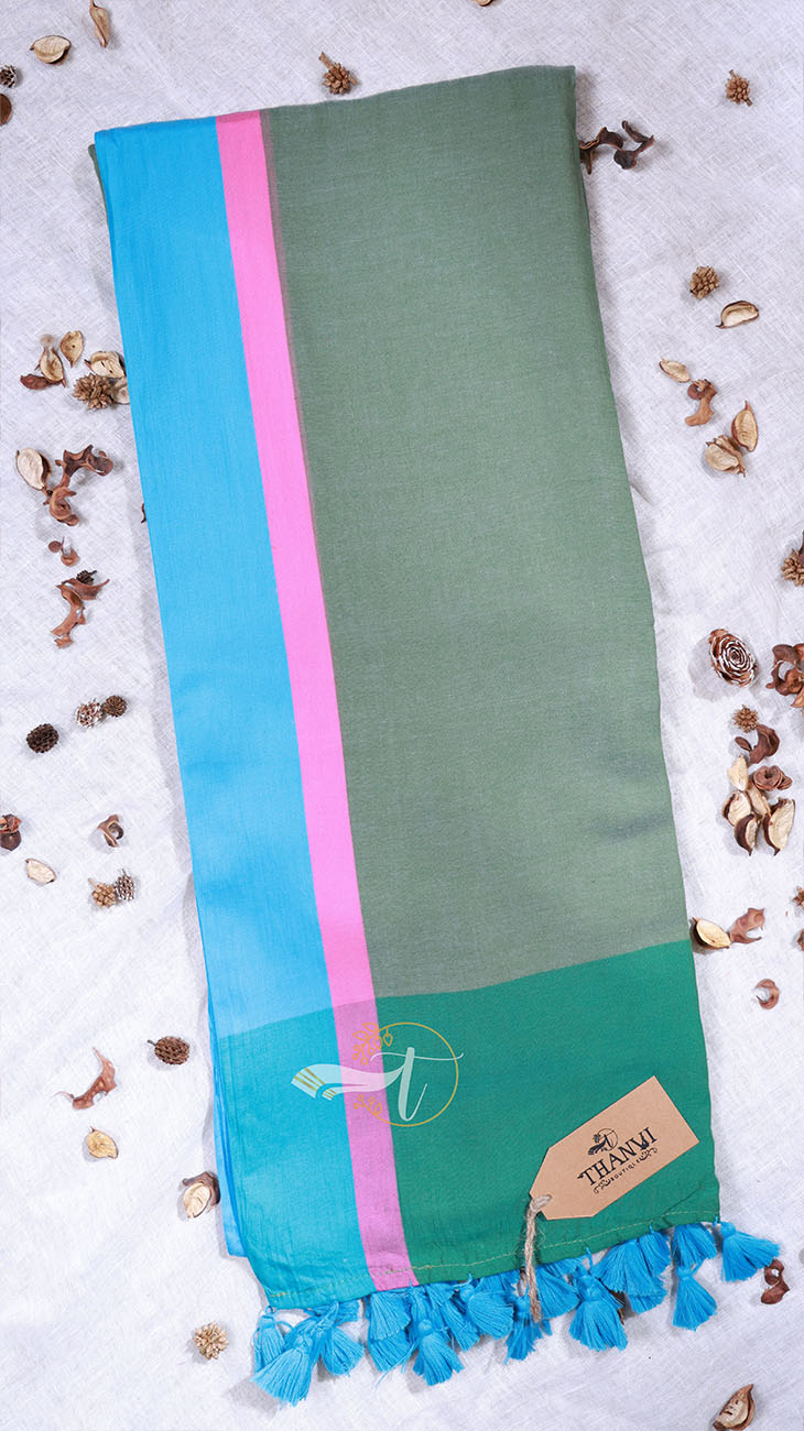 Green scarf with pink and blue stripes on a light background