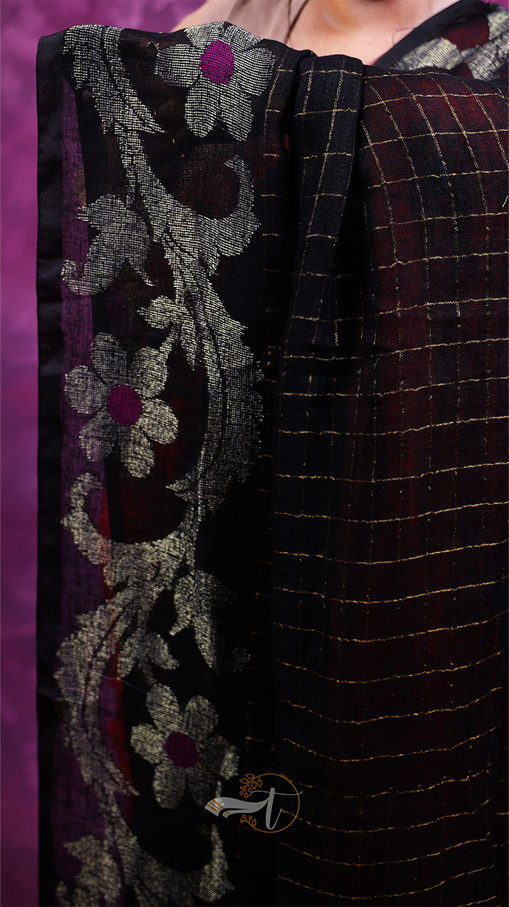 Close-up of a fabric with floral embroidery and a checkered pattern on a purple background