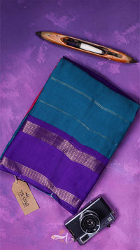 Purple and teal saree with a camera and loom on a purple background