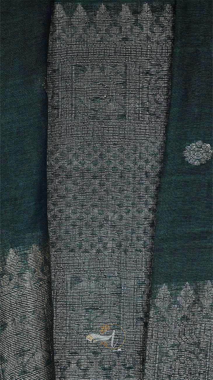 Textured fabric with intricate patterns and a brand logo on a dark background