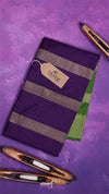 Purple fabric with striped pattern on a purple background