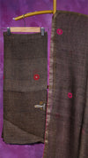 Brown fabric with red floral embroidery on a purple background
