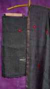 Dark gray fabric with red buttons on a purple background