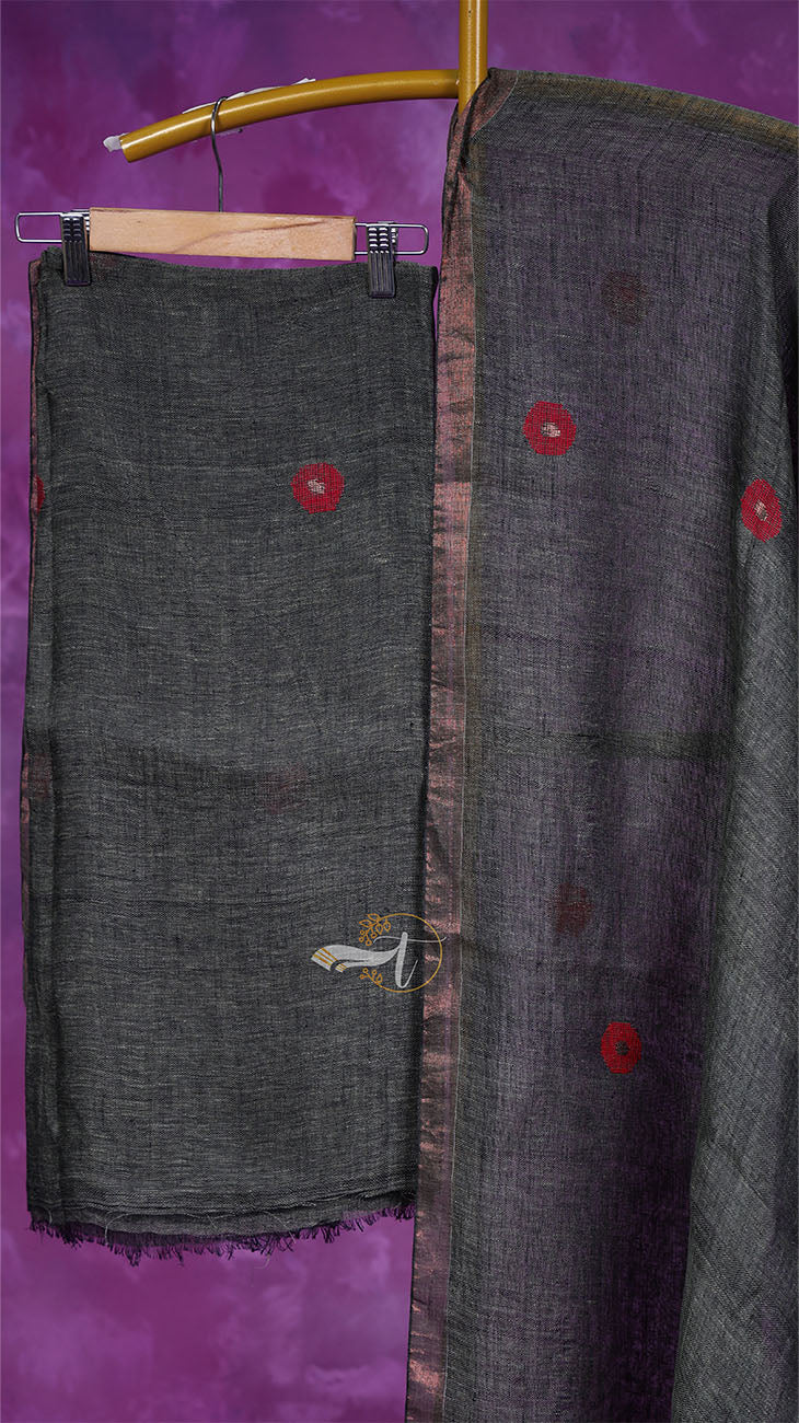 Dark gray fabric with red buttons on a purple background