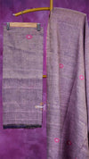 Purple fabric with pink floral patterns on a purple background