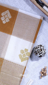 Textile with cross-stitch patterns on a textured surface
