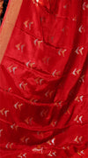 Red fabric with gold and white patterns