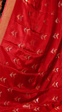 Red fabric with gold and white patterns