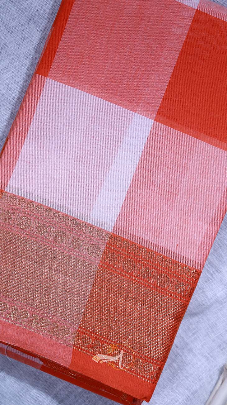 Red and pink checkered fabric with a subtle pattern on a light gray background