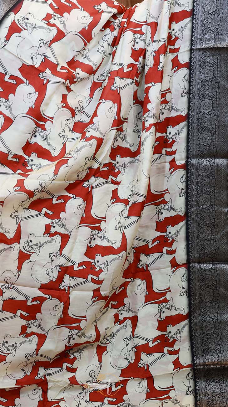 Fabric with a pattern of white animals on a red background, displayed against a dark fabric background.
