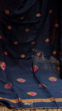 Navy blue fabric with gold and pink floral patterns
