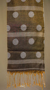 Textile with polka dots and stripes on a plain background