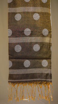 Textile with polka dots and stripes on a plain background