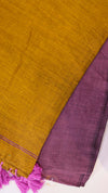 Mustard and purple fabric with fringes on a white background