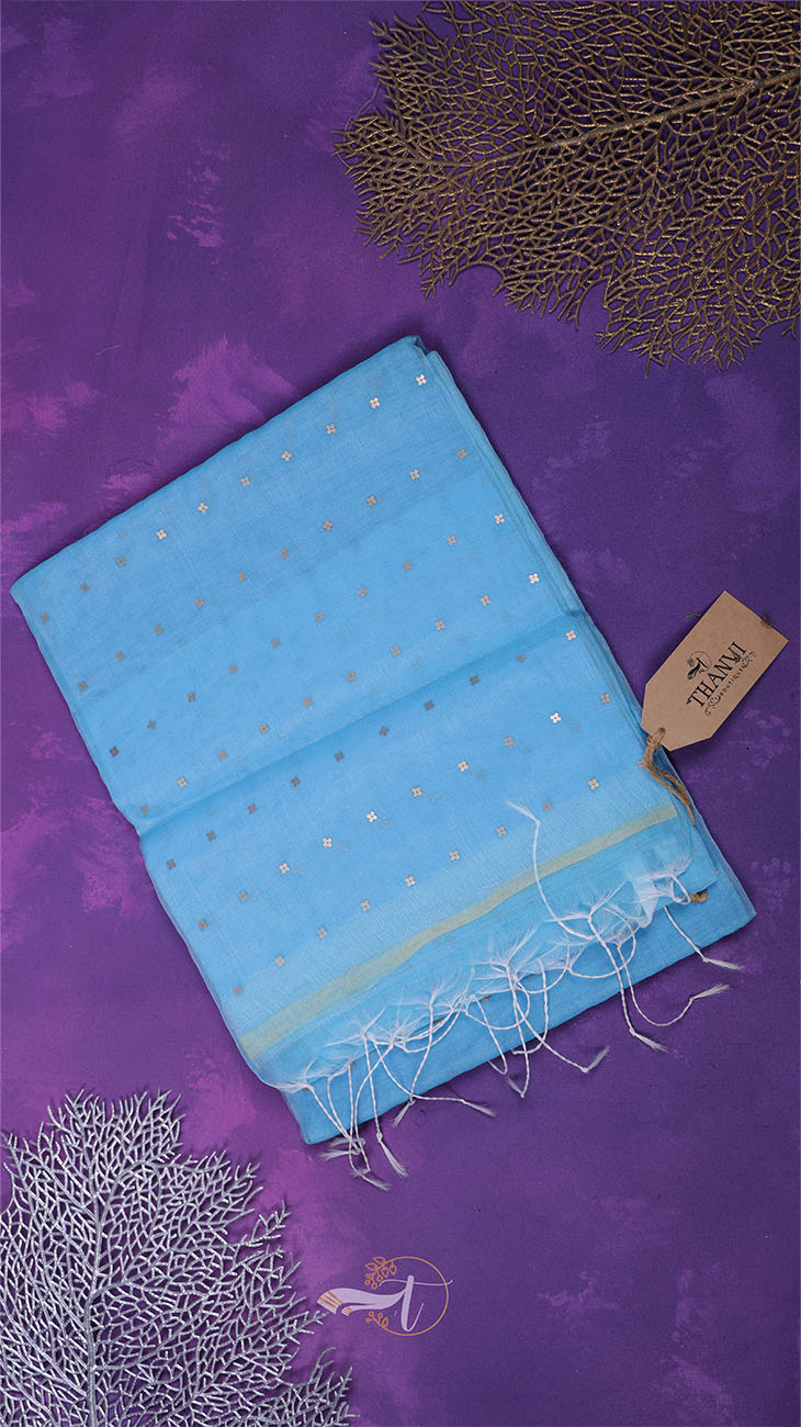 Blue fabric with gold patterns on a purple background