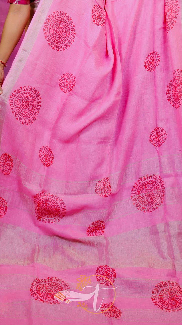 Pink fabric with red floral patterns