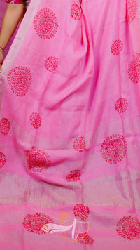 Pink fabric with red floral patterns