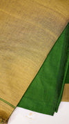 Close-up of green fabric with a textured brown background