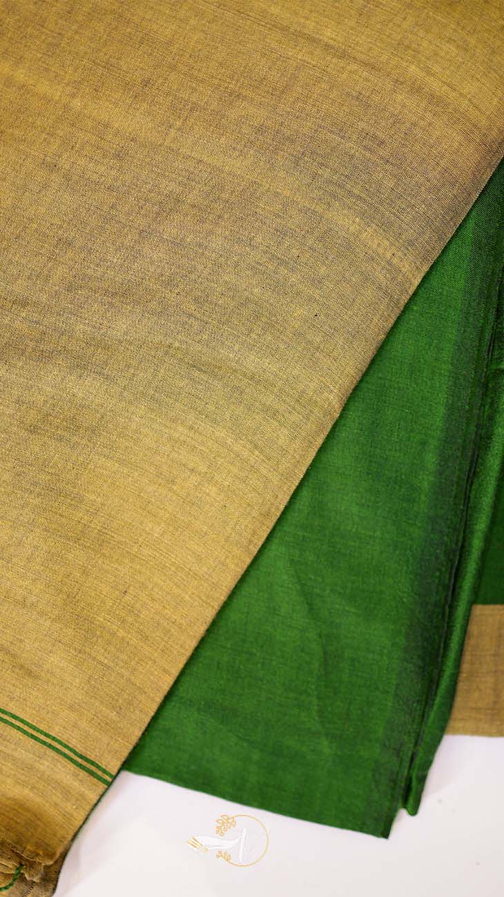 Close-up of green fabric with a textured brown background