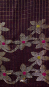 Close-up of floral patterned fabric with a grid background
